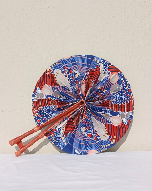 Blue & Red Geometric Fan - handmade blue, red and cream geometric cotton fan with leather handle by Yaw Broni