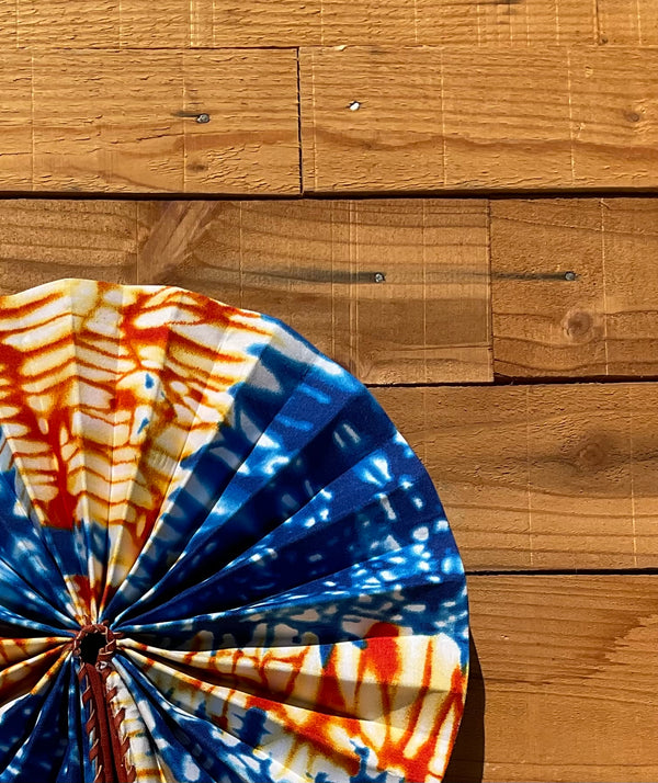 Blue & Red Tie-Dye Fan - handmade blue, red and cream tie-dye cotton fan with leather handle by Yaw Broni