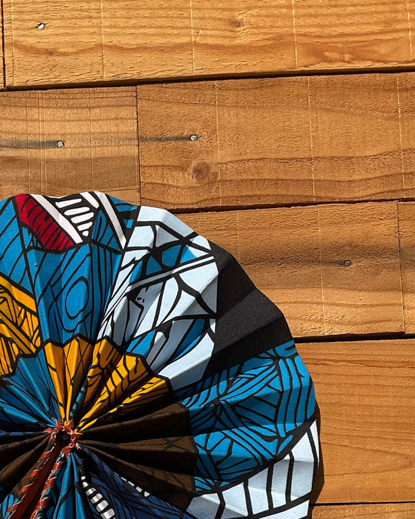 Navy & Orange Geometric Fan - handmade navy and orange geometric cotton fan with leather handle by Yaw Broni