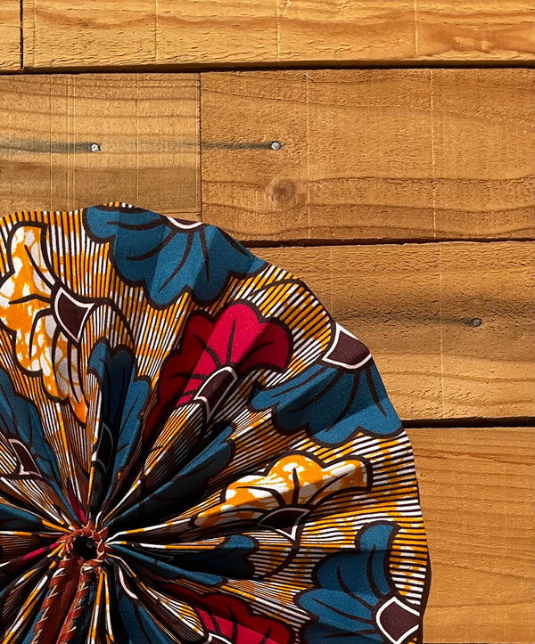 Blue & Orange Floral Fan - handmade blue, orange and red floral cotton fan with leather handle by Yaw Broni